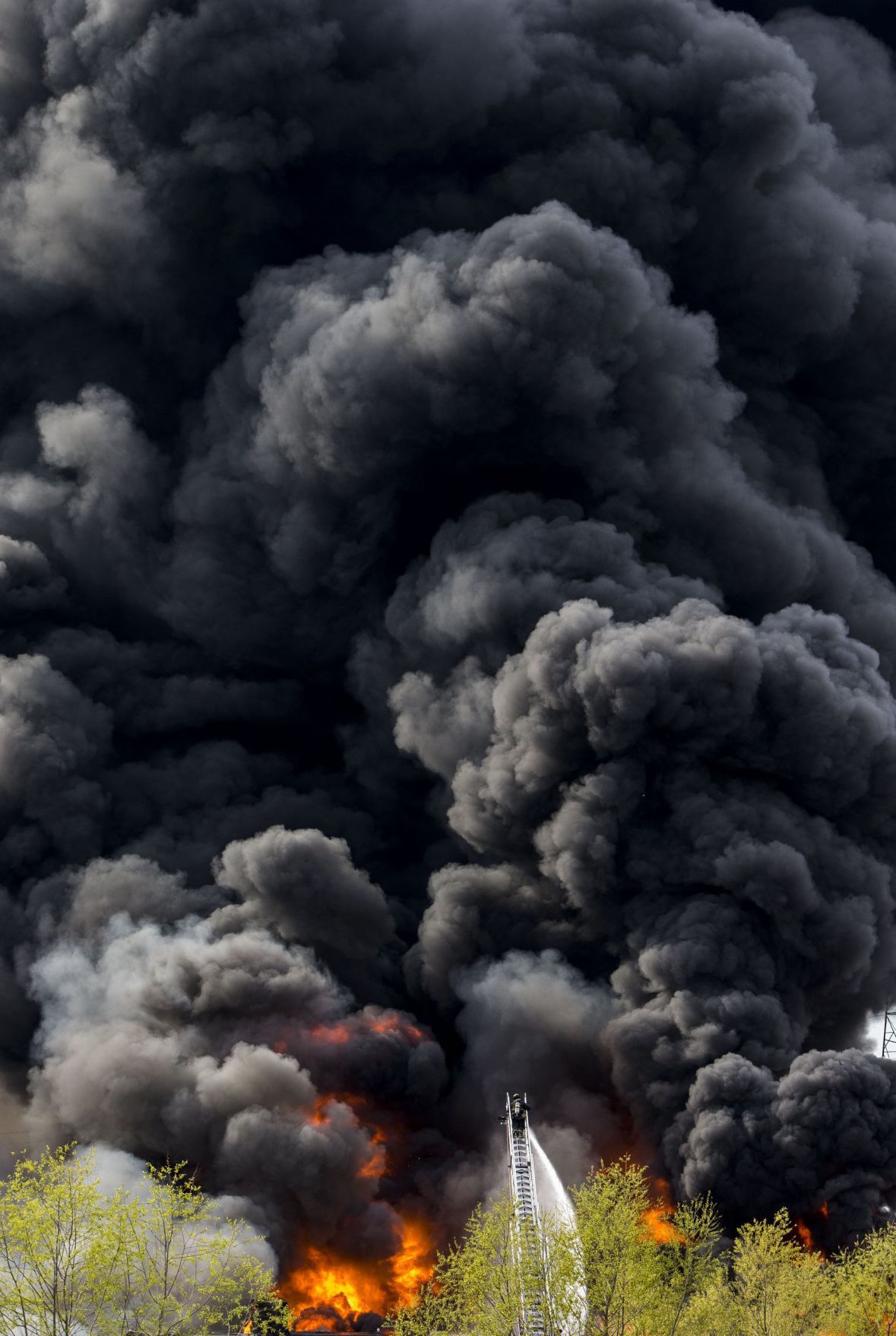 Large fire rolls through warehouse